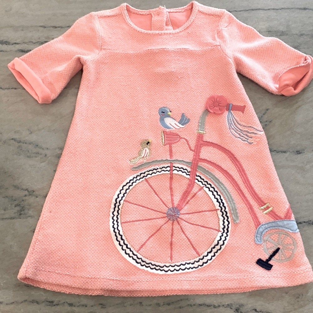 Cute Easter dress. A few small pulls. We loved this one!